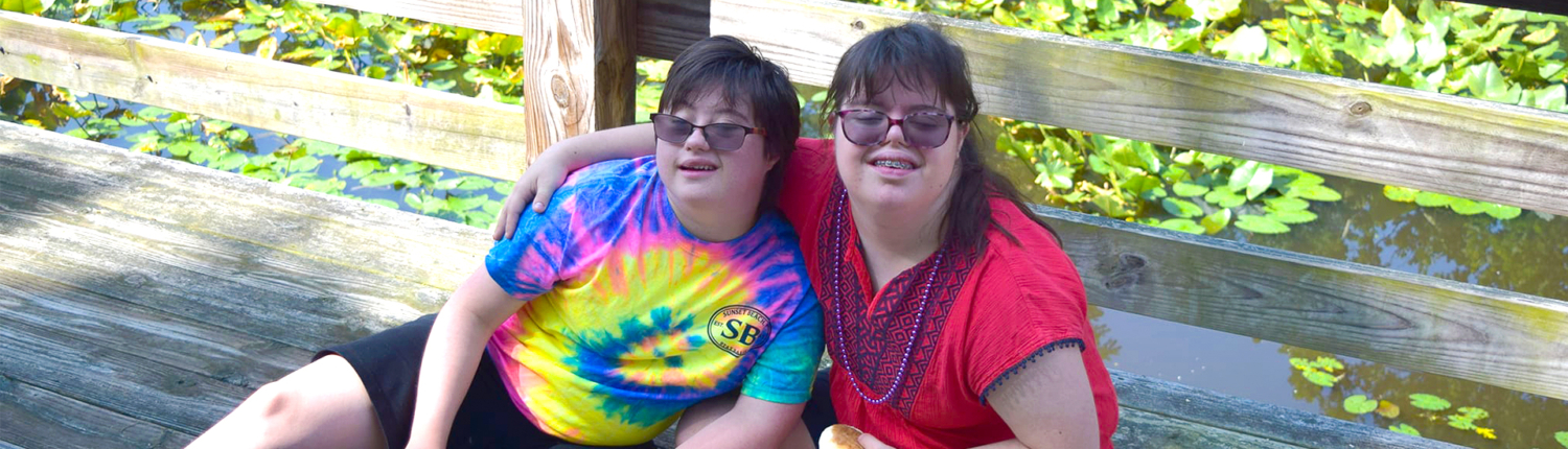 Camp Easterseals UCP campers smiling on a deck