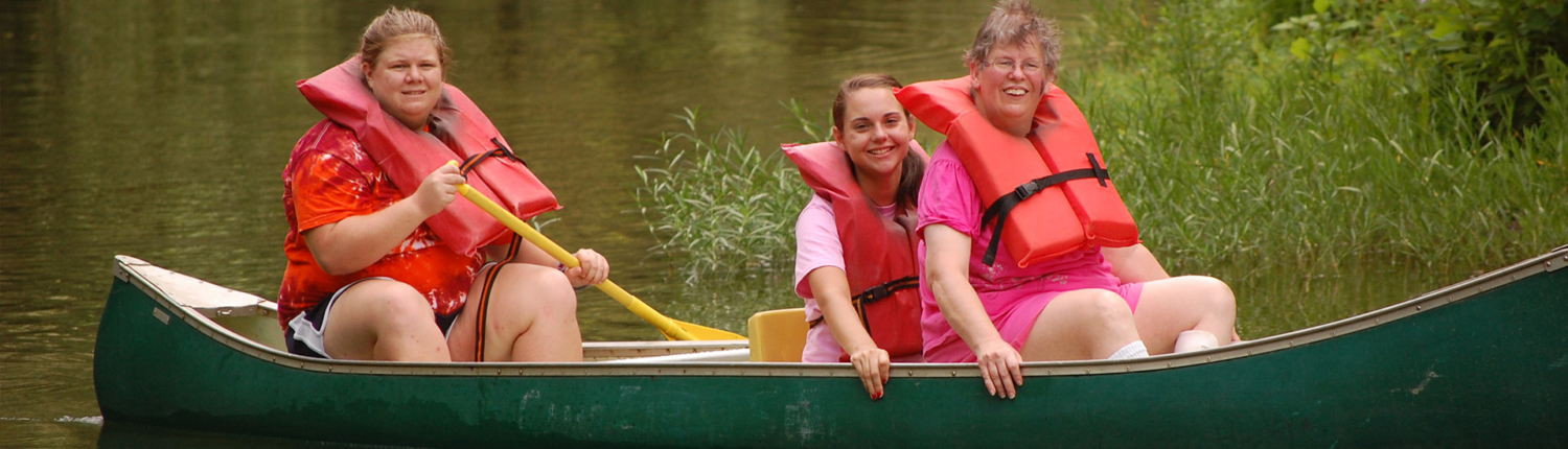 Adults in EMPOWER Wellness and Recreation in canoe on a lake