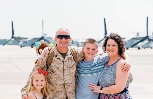 Military member and family smiling