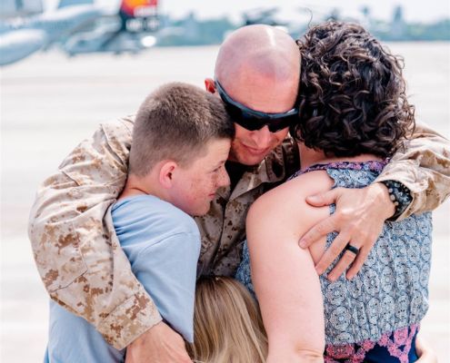 Military member and family smiling